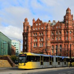 a yellow bus in front of building