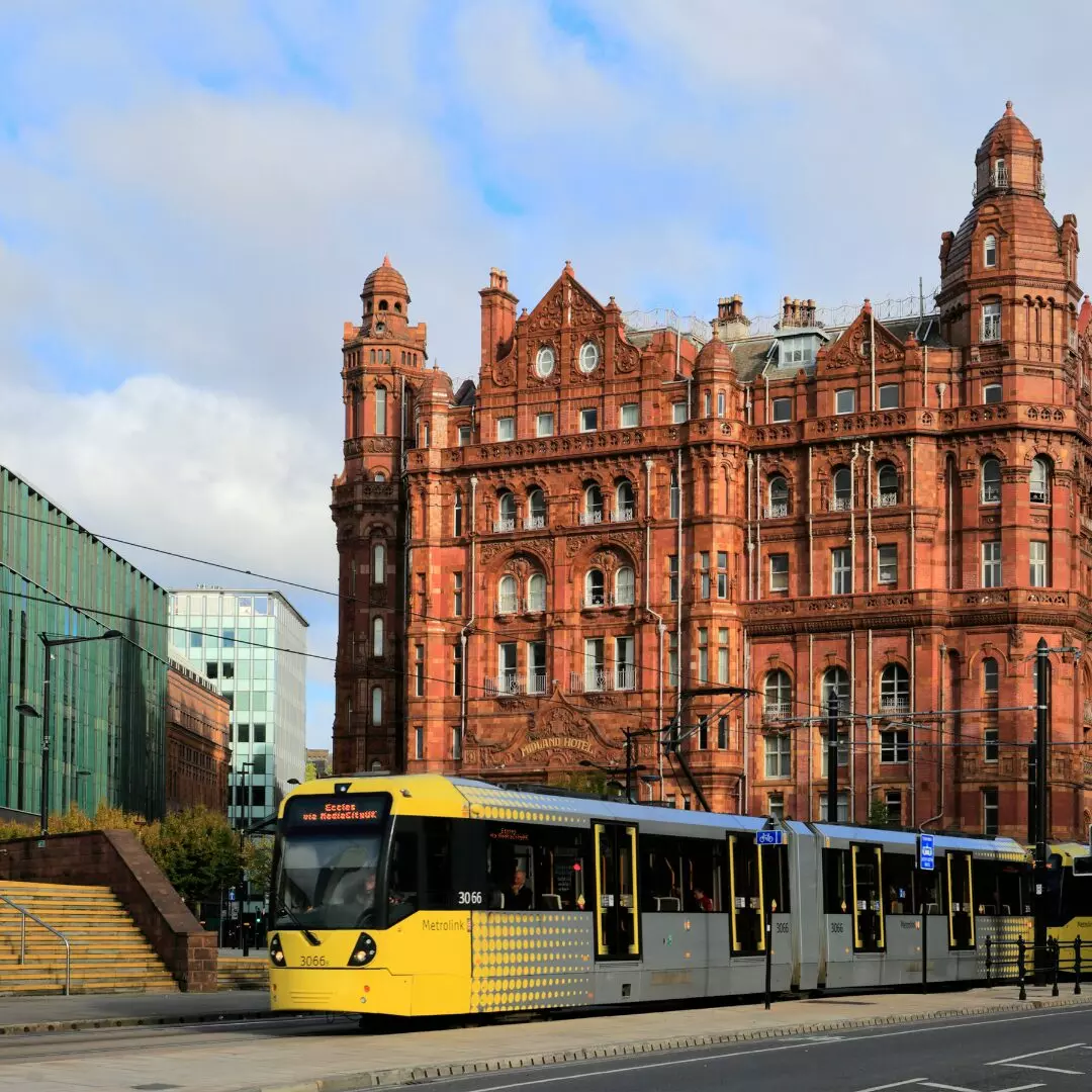 a yellow bus in front of building